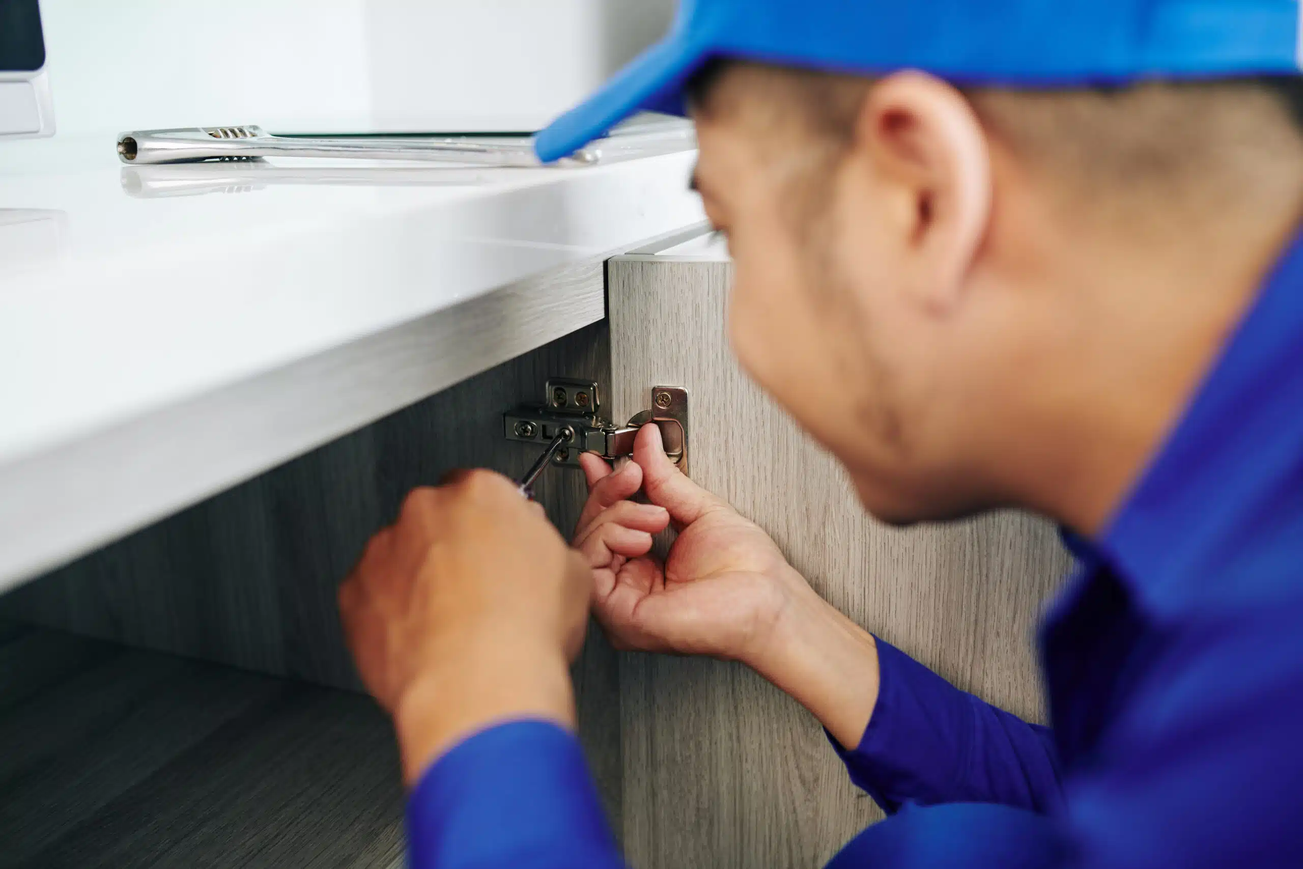Worker assembling furniture